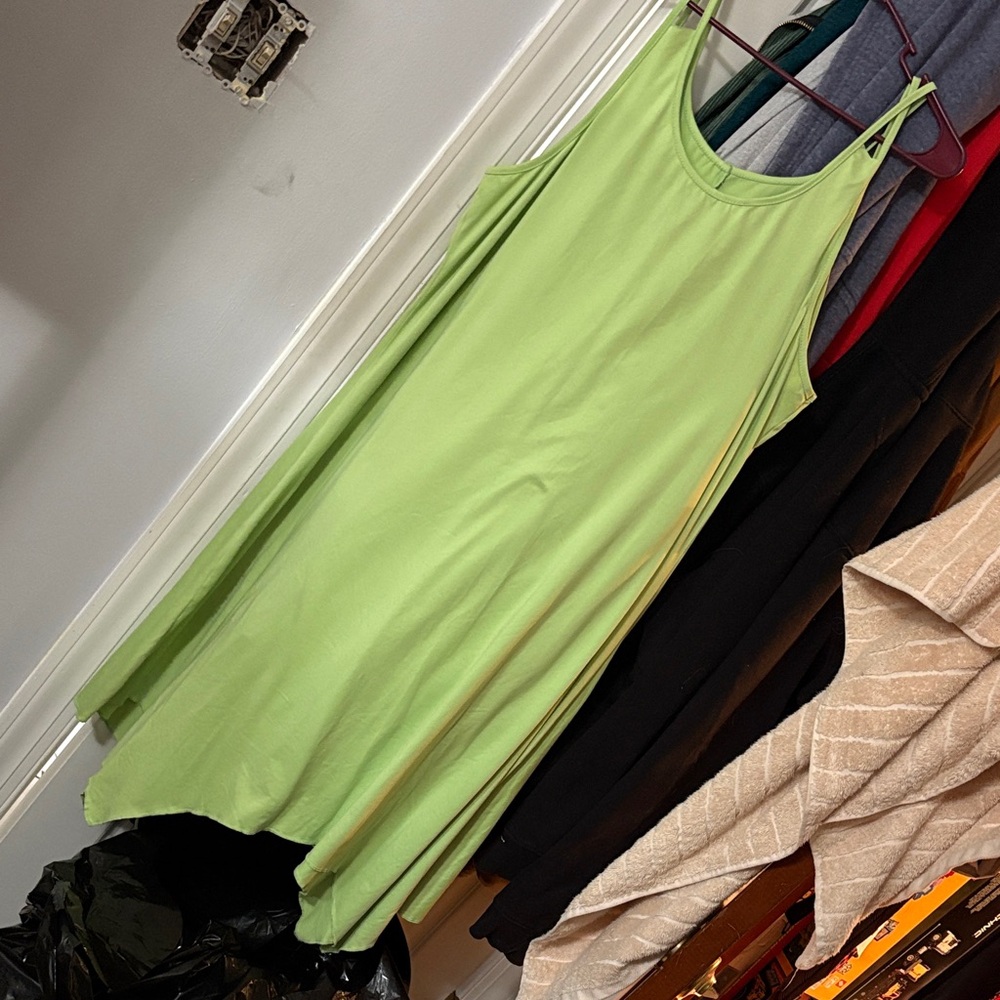 Bright green sundress with asymmetrical hem